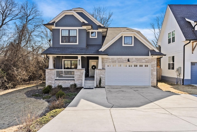 craftsman-style house featuring a garage and covered porch