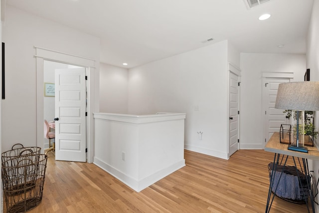 corridor featuring hardwood / wood-style floors