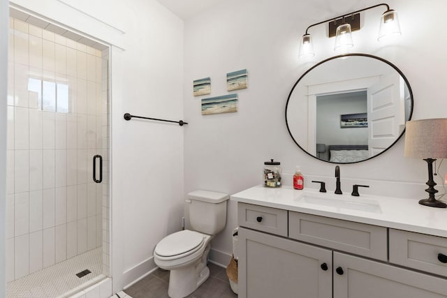 bathroom featuring vanity, a shower with shower door, tile patterned floors, and toilet