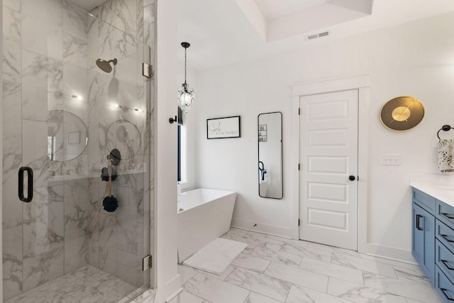 bathroom featuring vanity and shower with separate bathtub