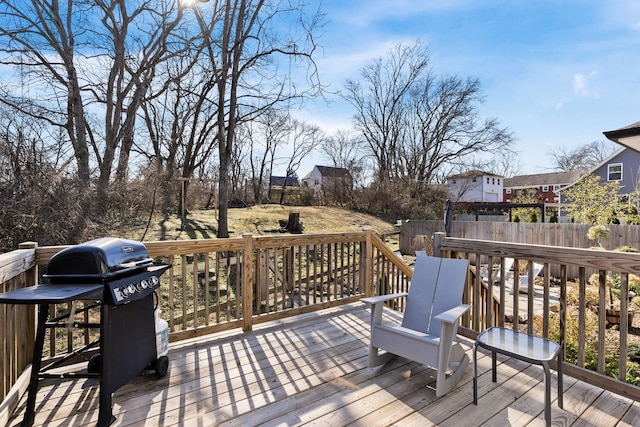 wooden deck featuring area for grilling