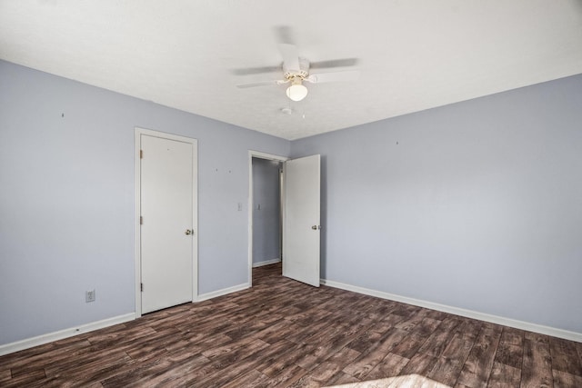 unfurnished bedroom with ceiling fan and dark hardwood / wood-style floors