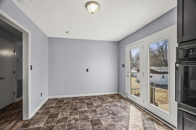 interior space featuring a textured ceiling