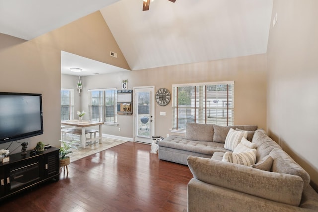 living room featuring ceiling fan, dark hardwood / wood-style floors, and high vaulted ceiling