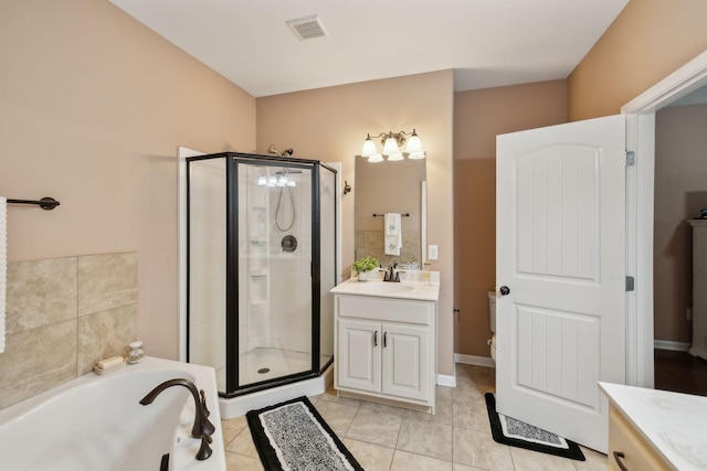 bathroom featuring independent shower and bath, vanity, and tile patterned flooring