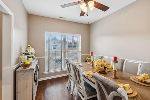 dining space featuring a wealth of natural light, dark wood-type flooring, and ceiling fan