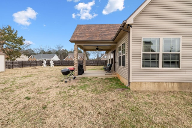 view of yard featuring a patio and ceiling fan