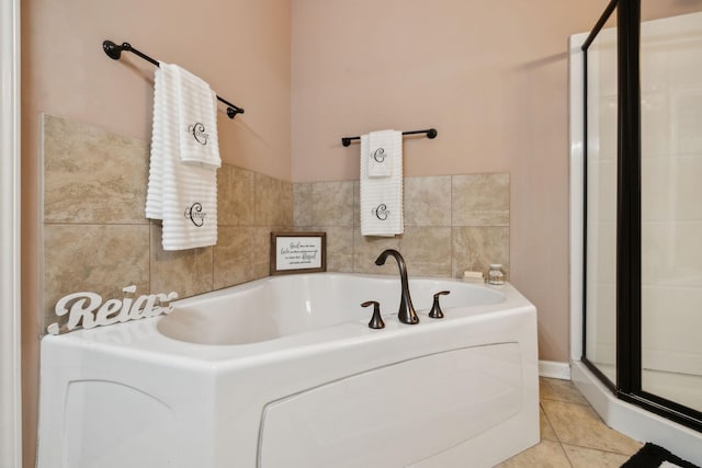 bathroom featuring tile patterned floors and a tub