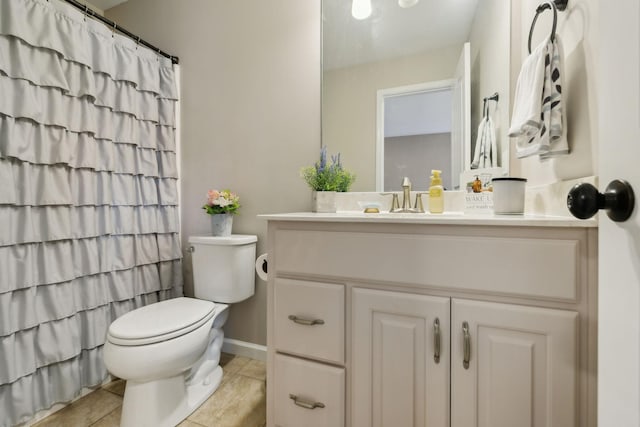 bathroom with tile patterned flooring, vanity, curtained shower, and toilet