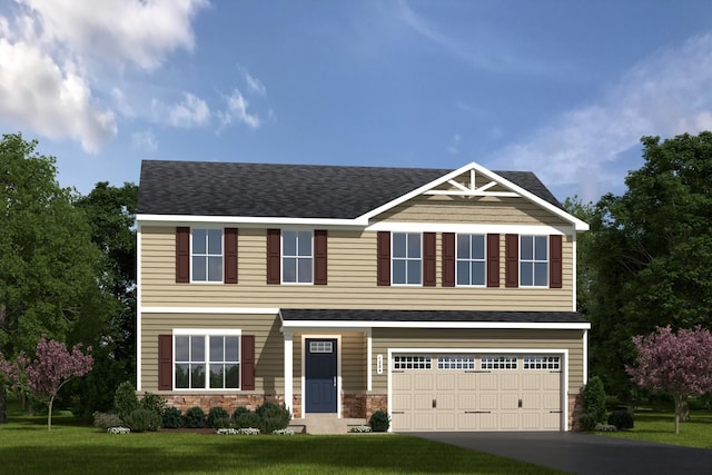 view of front facade featuring a garage and a front lawn