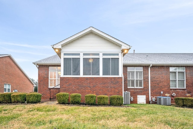 view of property exterior featuring a yard and central air condition unit