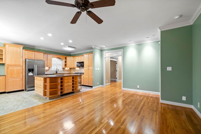 kitchen with crown molding, range, stainless steel refrigerator with ice dispenser, a kitchen island, and light wood-type flooring