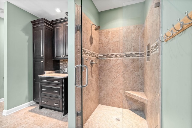 bathroom featuring vanity and walk in shower