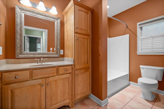 full bathroom with washtub / shower combination, vanity, toilet, and tile patterned flooring