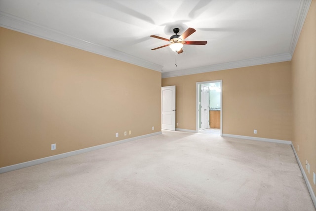 unfurnished room featuring crown molding, light colored carpet, and ceiling fan