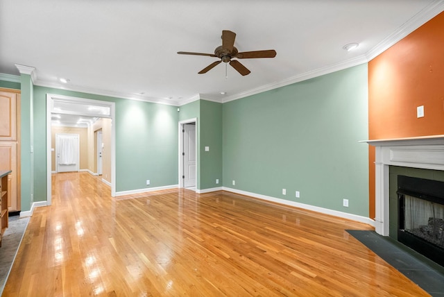 unfurnished living room with crown molding, light hardwood / wood-style flooring, and ceiling fan