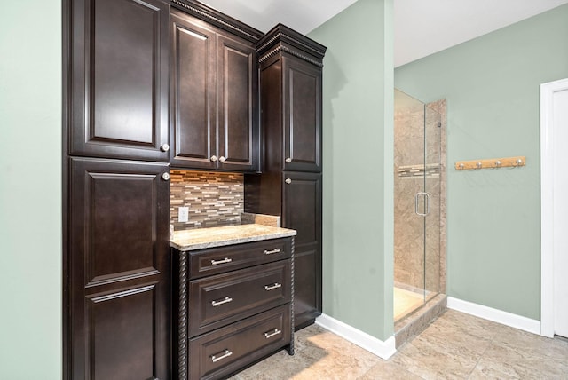 interior space featuring dark brown cabinets and decorative backsplash