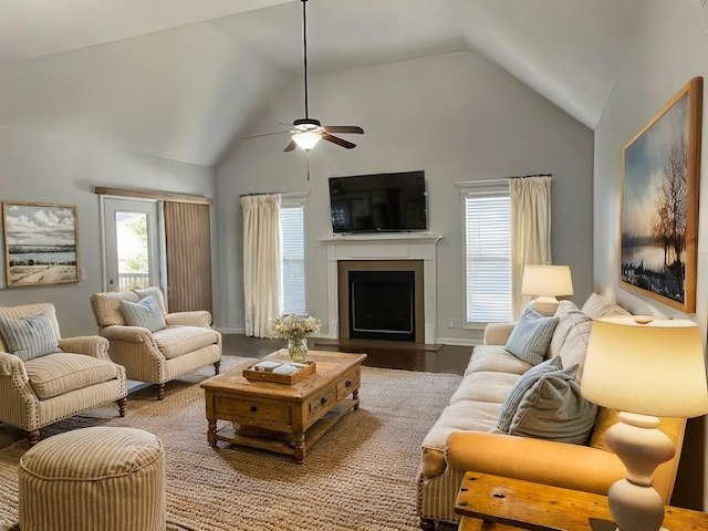 living room with lofted ceiling, hardwood / wood-style flooring, a wealth of natural light, and ceiling fan