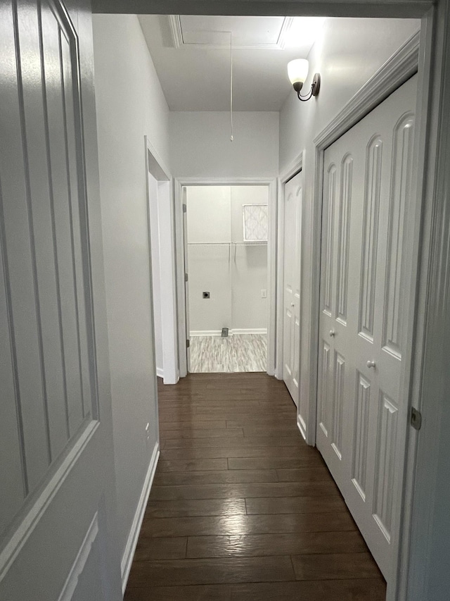 hallway with dark hardwood / wood-style floors