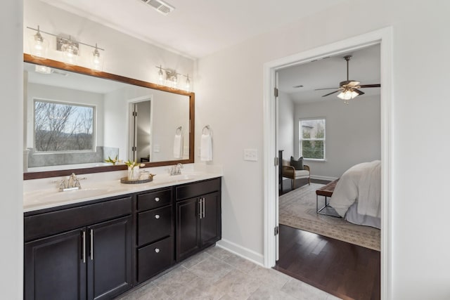 bathroom featuring vanity, hardwood / wood-style floors, and ceiling fan