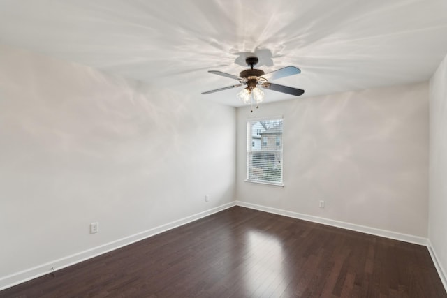 unfurnished room featuring dark hardwood / wood-style floors and ceiling fan