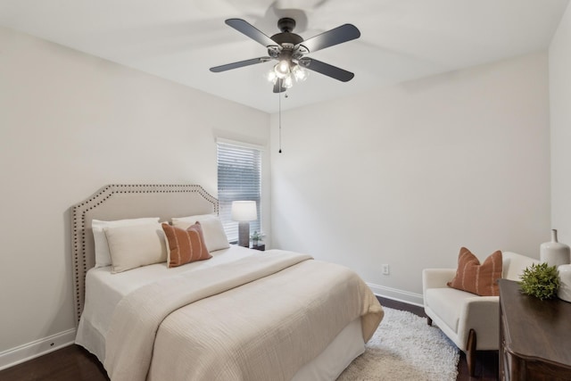 bedroom with dark wood-type flooring and ceiling fan