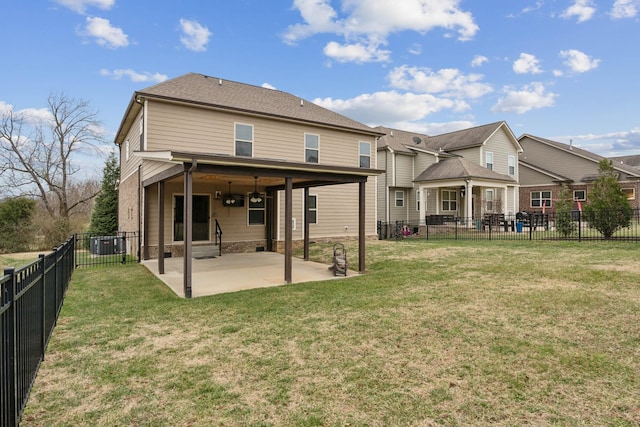 rear view of property with a patio area and a lawn