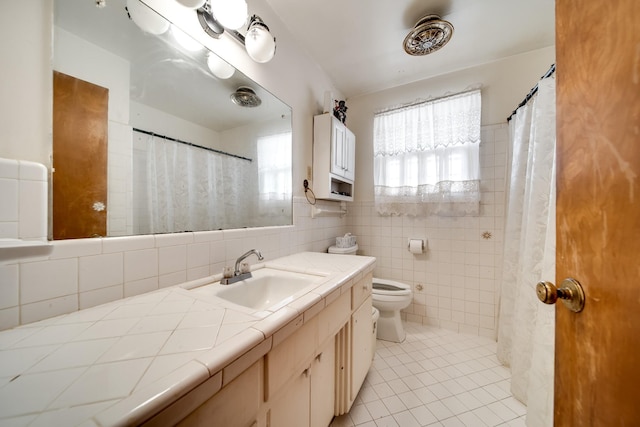 bathroom featuring tile walls, decorative backsplash, tile patterned flooring, vanity, and toilet