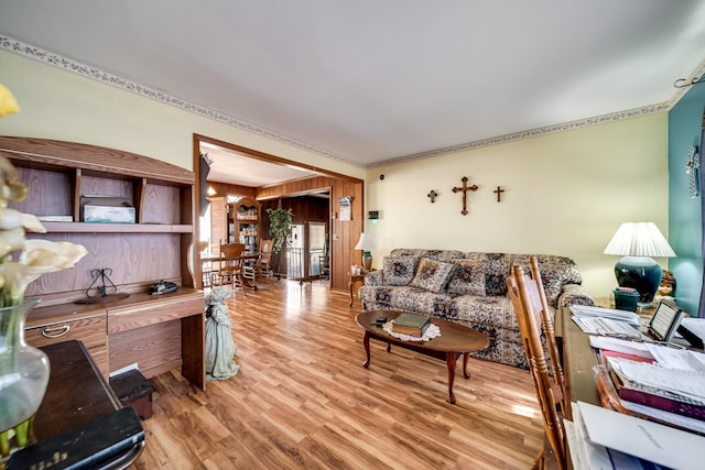 living room featuring hardwood / wood-style flooring and wood walls