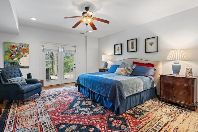 bedroom featuring access to exterior, ceiling fan, and light hardwood / wood-style flooring