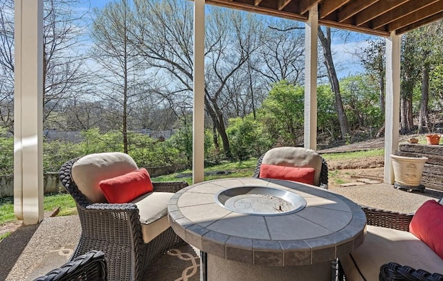 view of patio with a fire pit