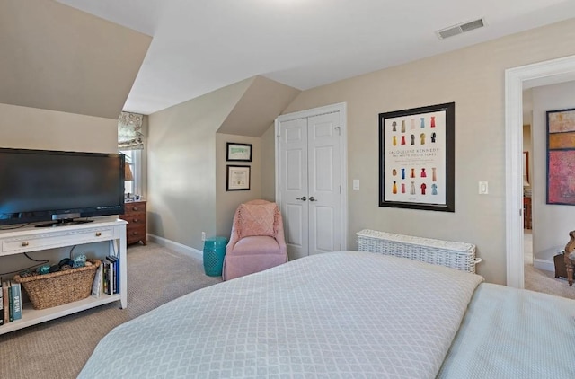 carpeted bedroom featuring a closet