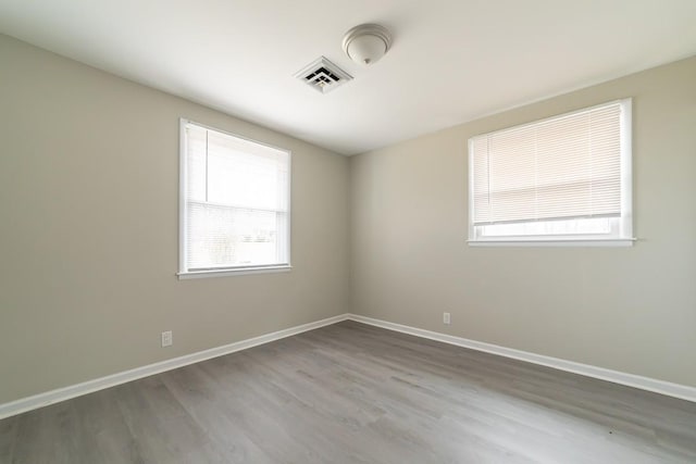 spare room featuring hardwood / wood-style flooring