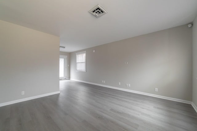 empty room featuring wood-type flooring