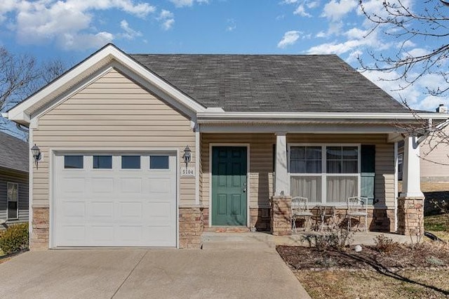 view of front of house featuring a garage and covered porch