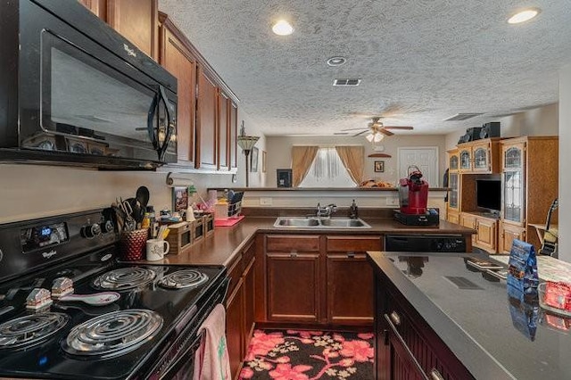 kitchen featuring ceiling fan, sink, a textured ceiling, and black appliances