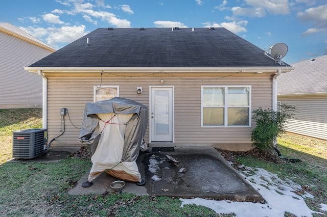 back of property with central air condition unit