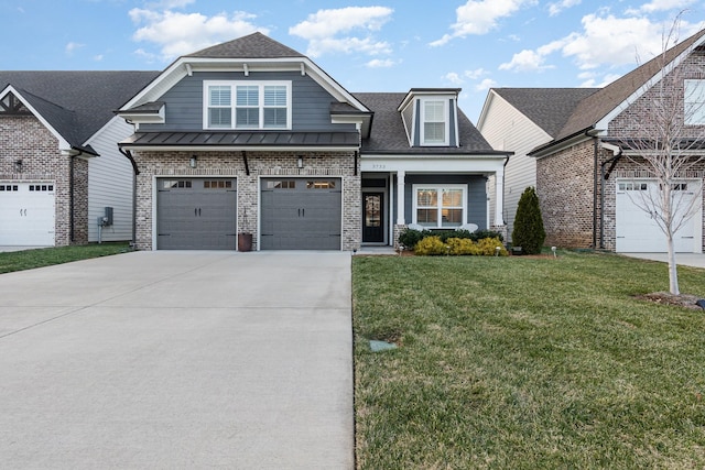 view of front of home featuring a garage and a front lawn