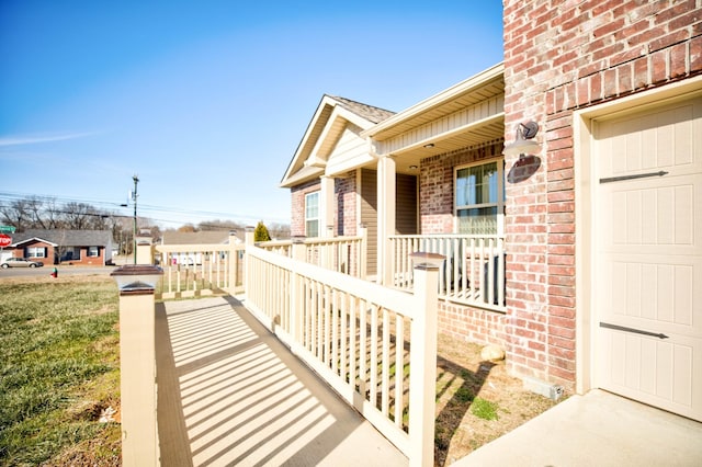 entrance to property featuring a porch