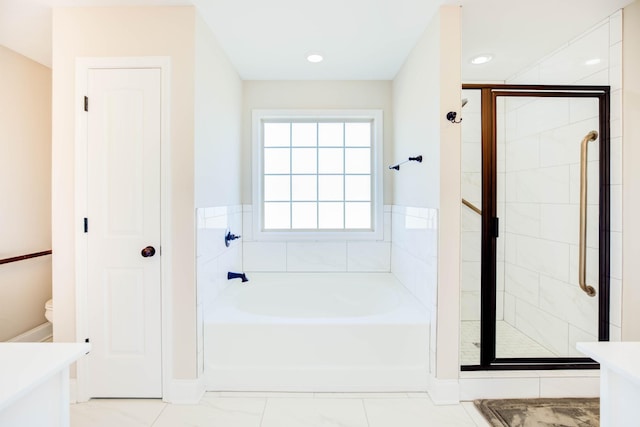 bathroom with vanity and independent shower and bath