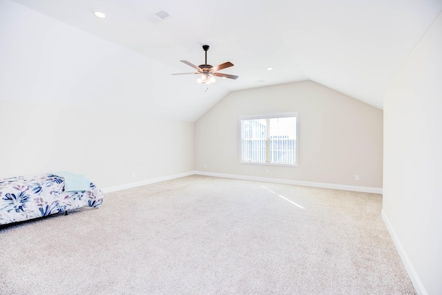 additional living space featuring lofted ceiling, ceiling fan, and carpet flooring