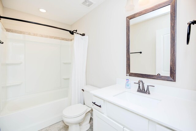 full bathroom with vanity, toilet, and shower / tub combo