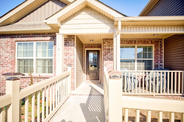 doorway to property featuring a porch