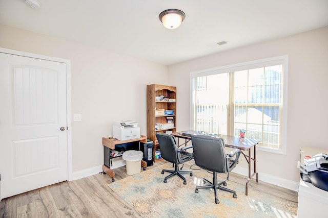 office space with hardwood / wood-style flooring