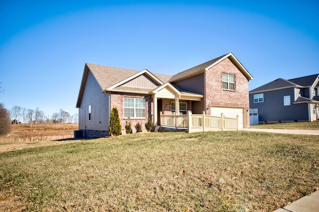 view of front of house with a garage, covered porch, and a front lawn