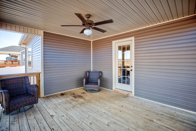 wooden deck with ceiling fan