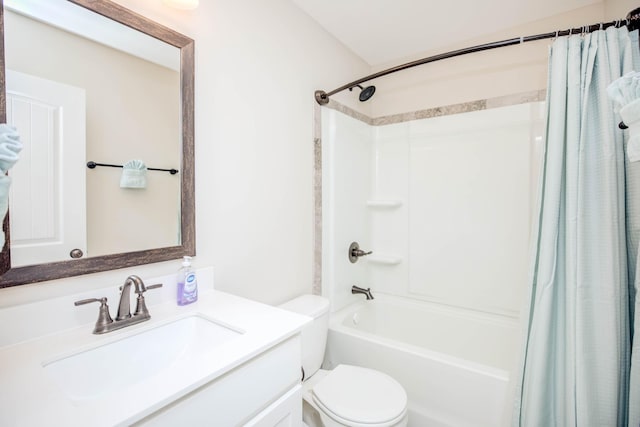 full bathroom featuring vanity, shower / bath combo, and toilet