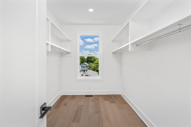 walk in closet featuring light hardwood / wood-style floors