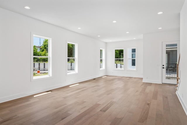 unfurnished living room featuring light hardwood / wood-style floors