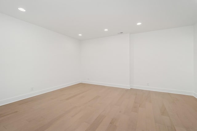 spare room with light wood-type flooring